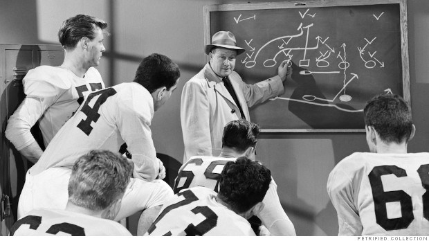 COACH SHOWS FOOTBALL PLAYERS DIAGRAMS IN 1950